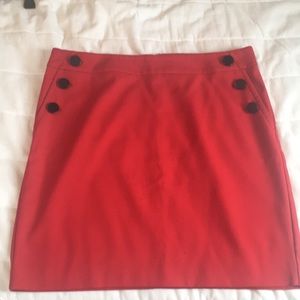 Red skirt with black buttons